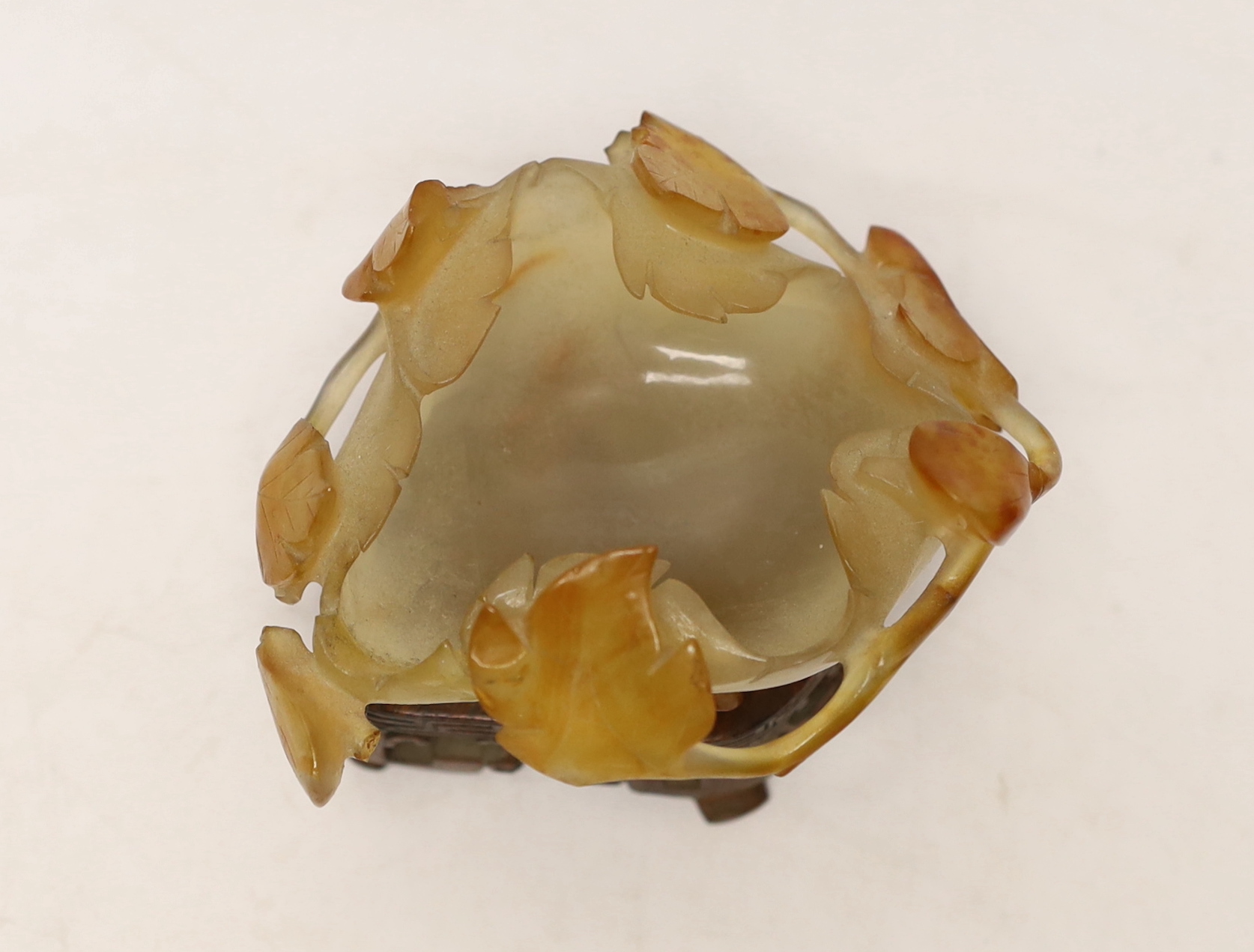 A Chinese agate brushwasher on carved stand, 8cms high including stand